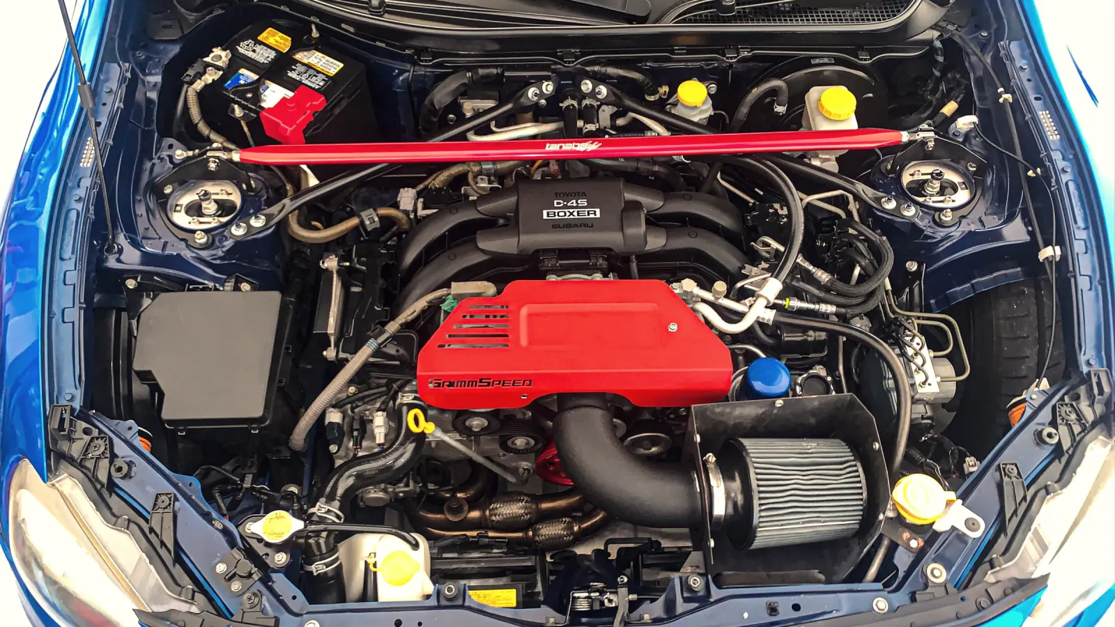 Engine bay of a blue Subaru BRZ, cleaned and serviced